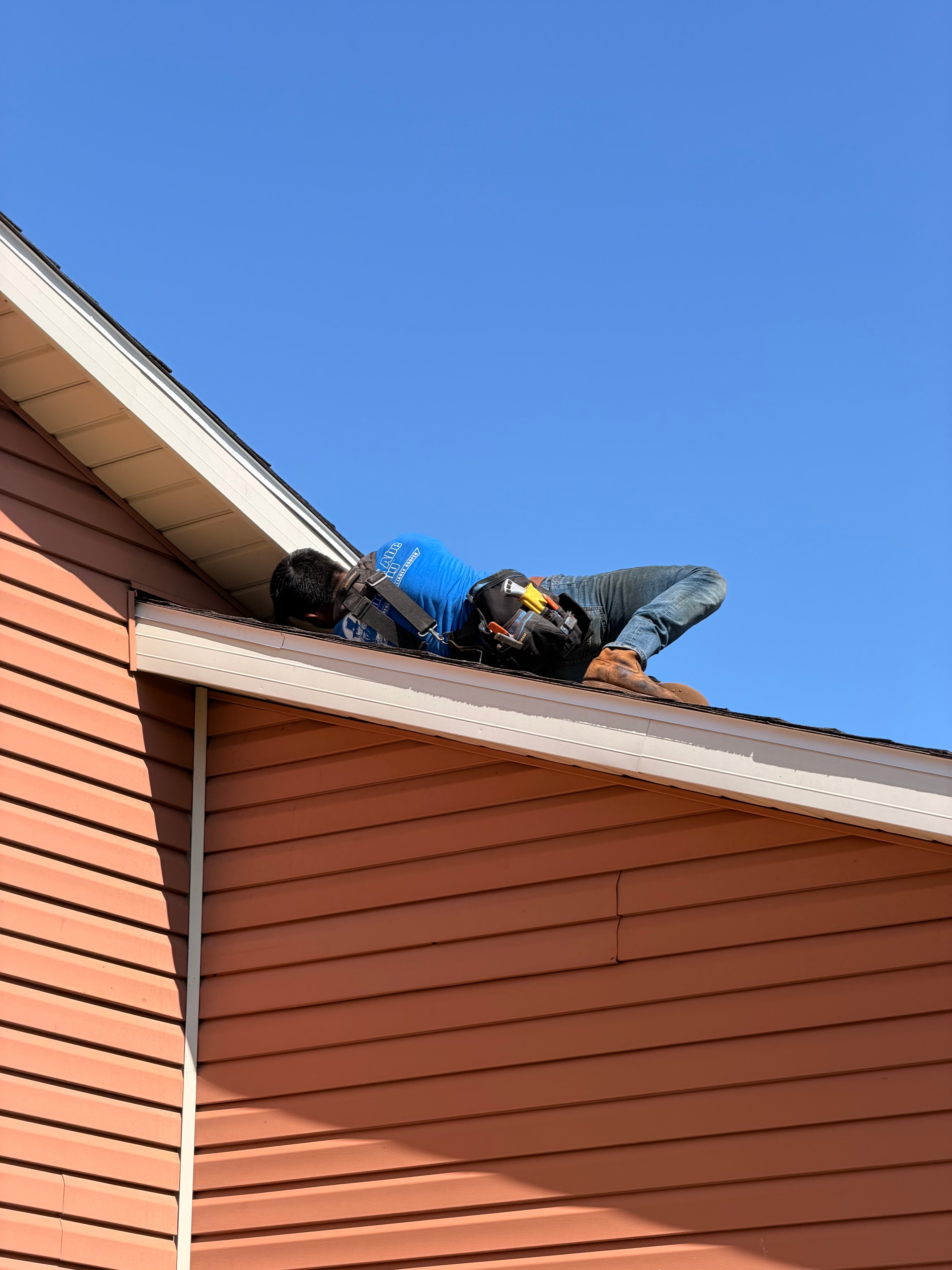 Underdog Roofing crew member on the job